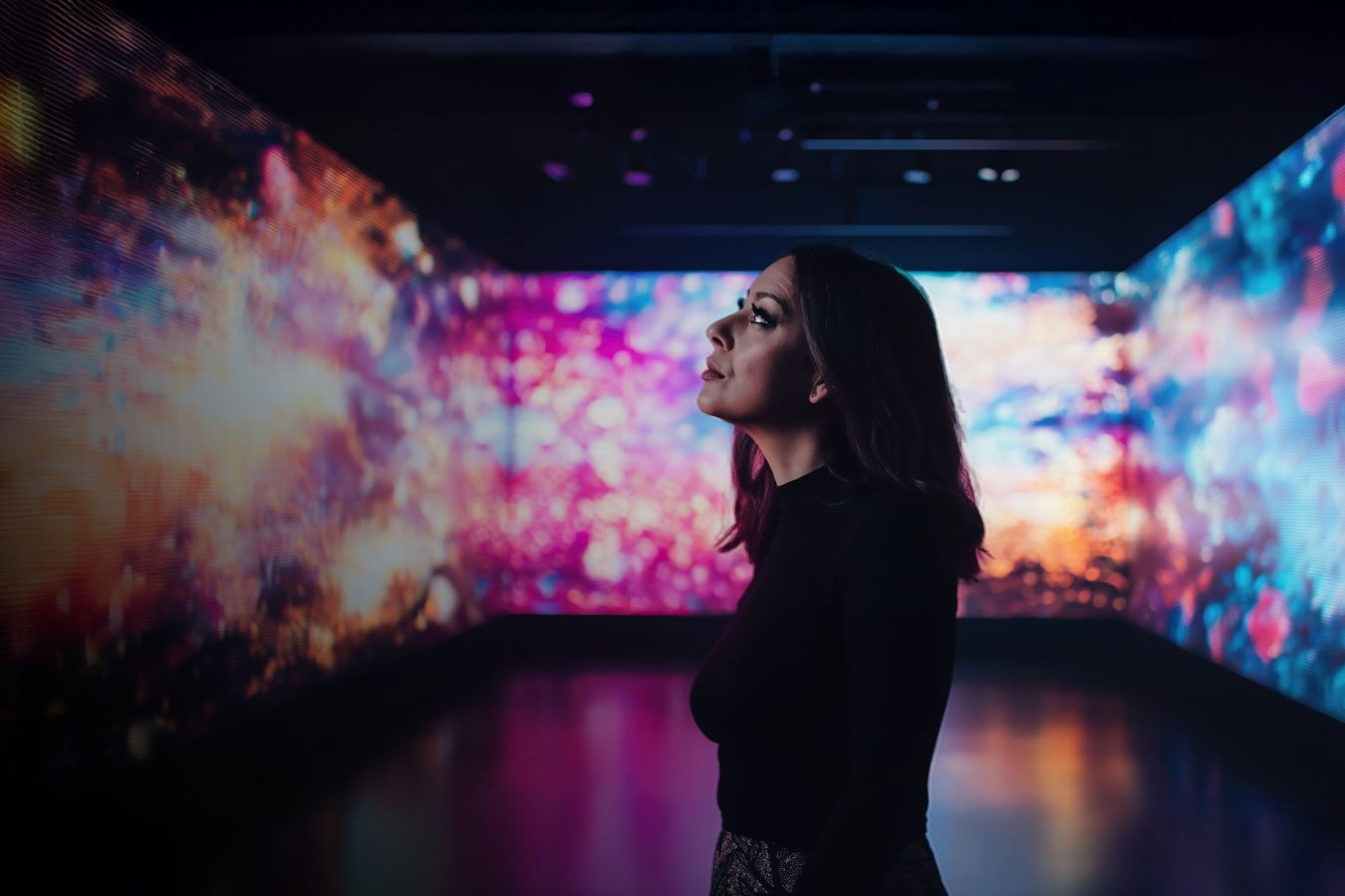Person in gallery enjoying the digital art Installation